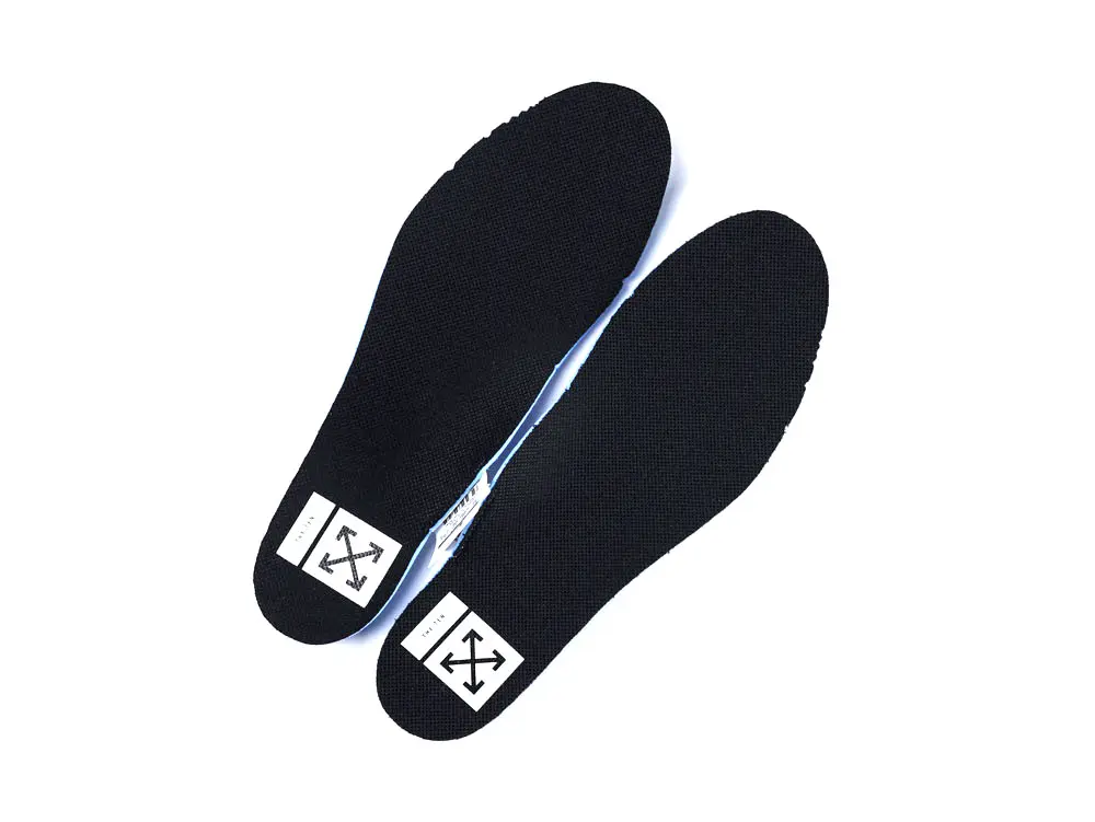 Black fabric shoe insoles with white logo at the heel area.