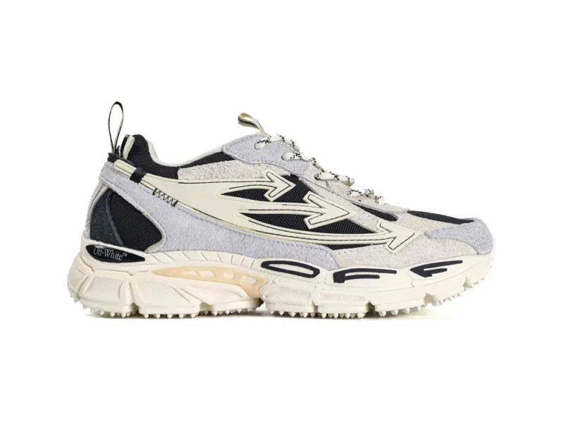 Cream and black sneaker with suede and mesh upper, featuring a chunky sole.