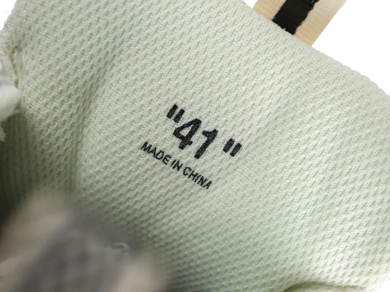White mesh sneaker interior with size "41" label, made in China.