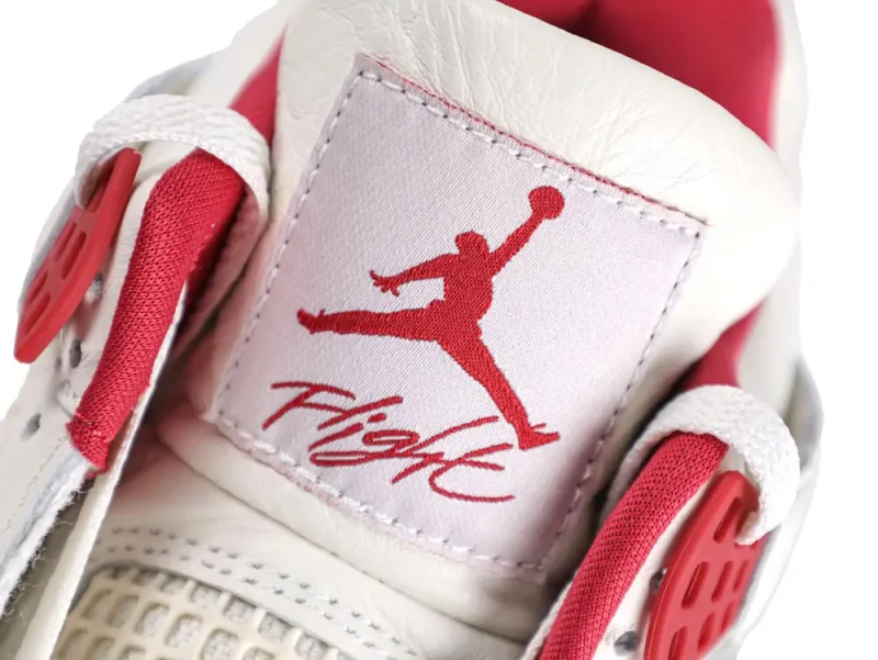 White foam insoles with red graphic prints, featuring lip and jumpman designs.