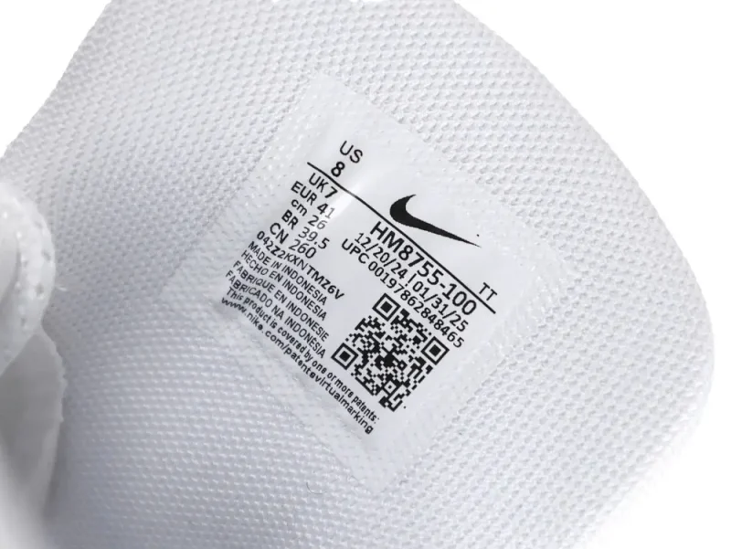 White leather sneaker with stitching and embroidered logo detailing.