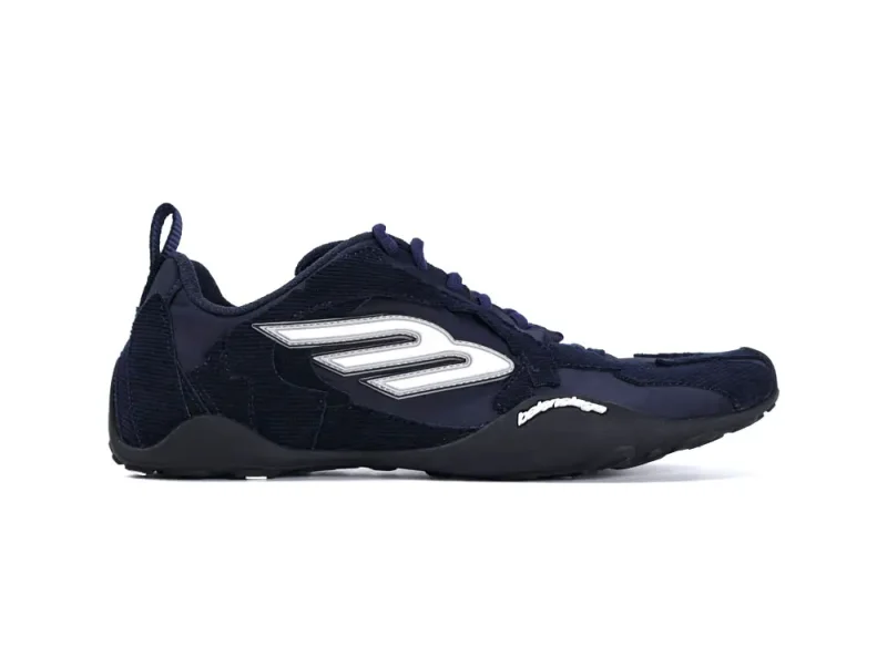 Navy blue sneaker with rubber sole and leather accents.