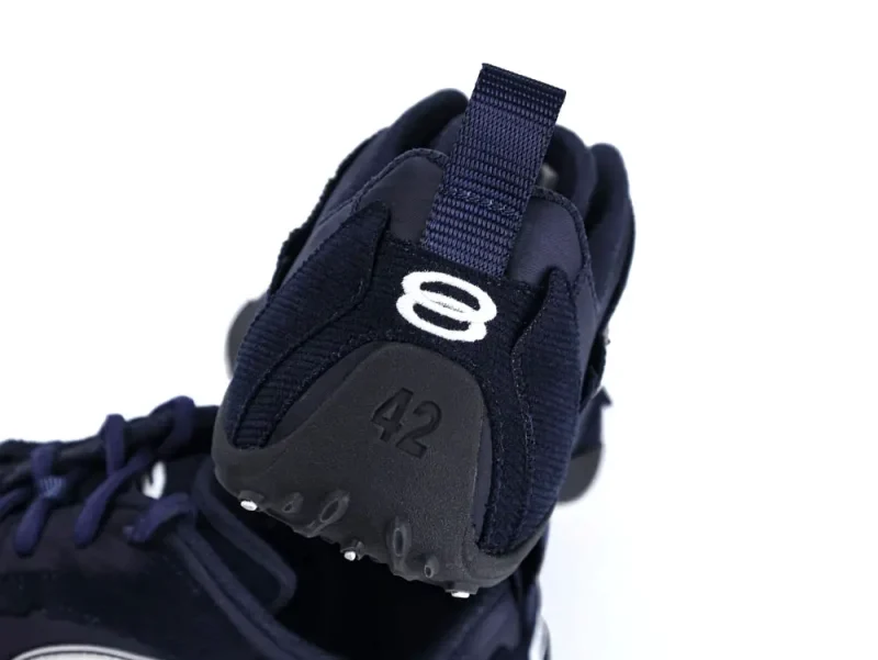 Navy textile and rubber shoe heel with size number 42 displayed.