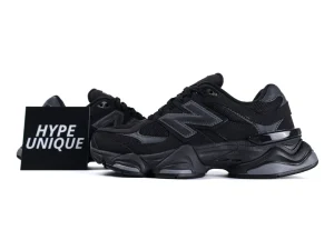 Black sneaker with mesh and synthetic material, featuring a sleek, cushioned sole design.