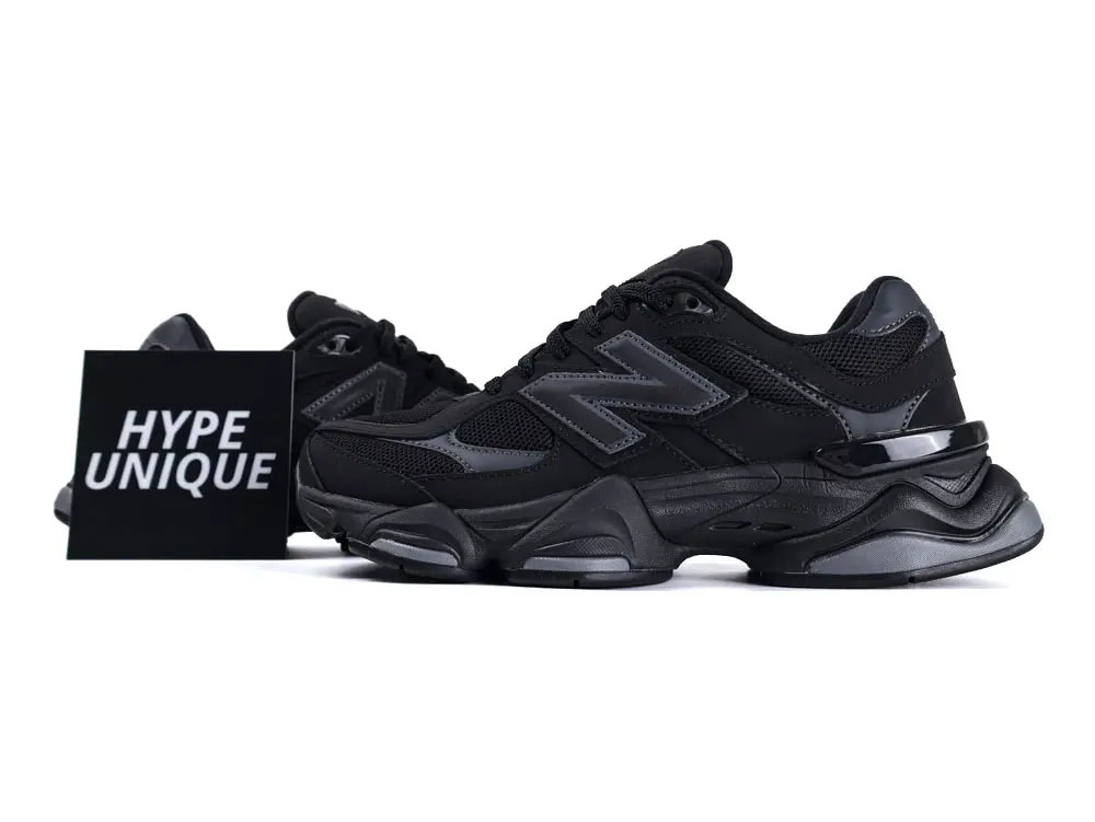 Black sneaker with mesh and synthetic material, featuring a sleek, cushioned sole design.