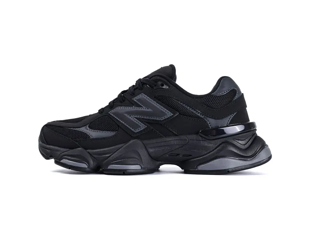 Black sneaker with mesh and synthetic material, featuring a sleek, cushioned sole design.