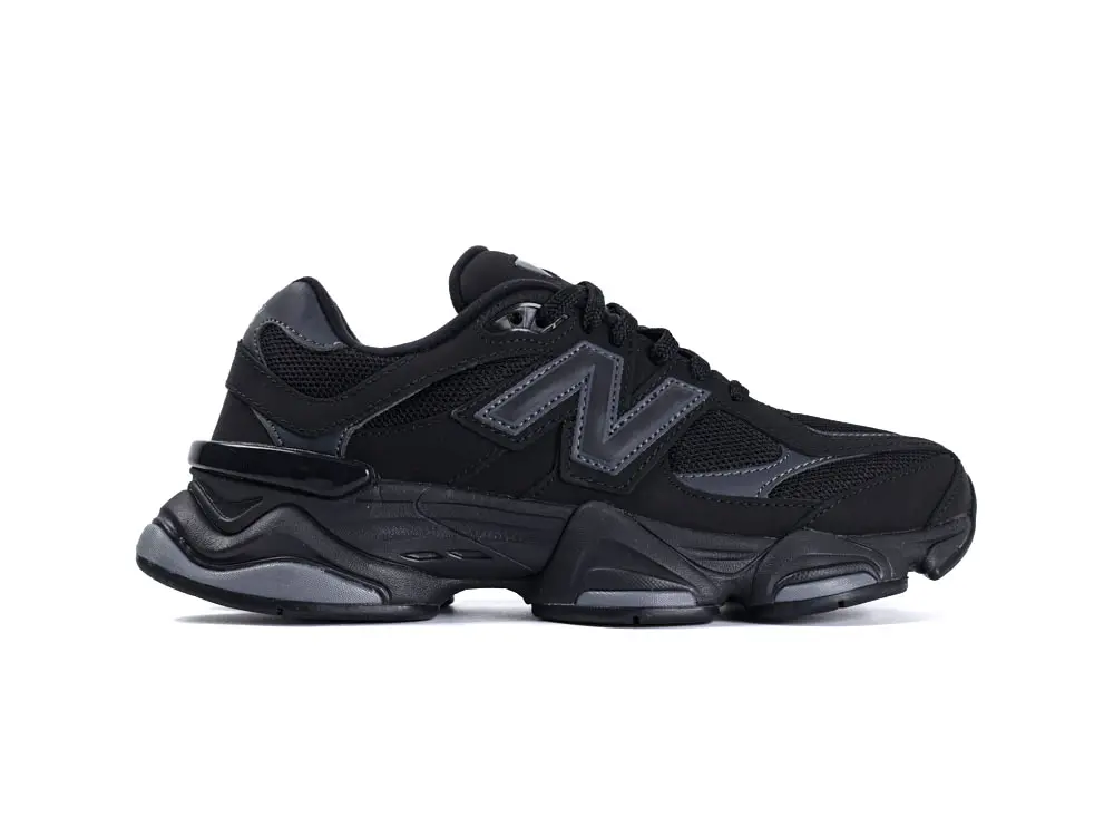 Black sneaker with mesh upper, leather accents, and rubber sole.