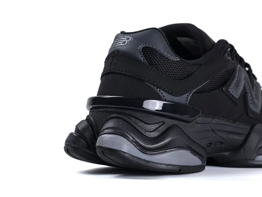 Black mesh and leather sneaker with a sleek, sturdy rubber sole.