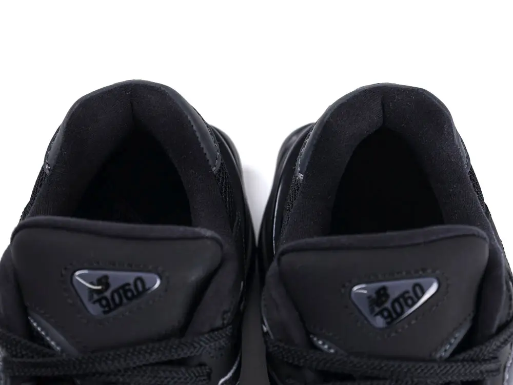Black sneaker uppers with mesh material and logo details on tongue.