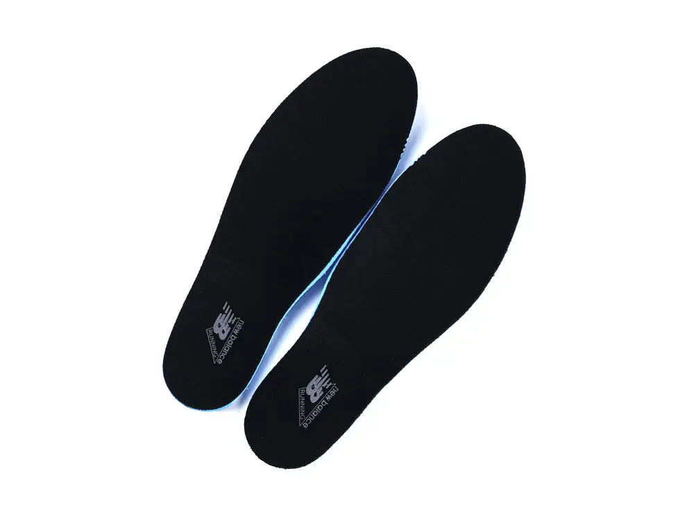 Black fabric insoles with a blue edge, featuring printed branding logo on top.
