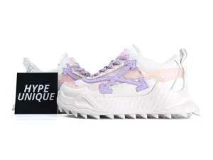 White sneakers with pink and purple accents, textured leather material, spiked rubber sole.