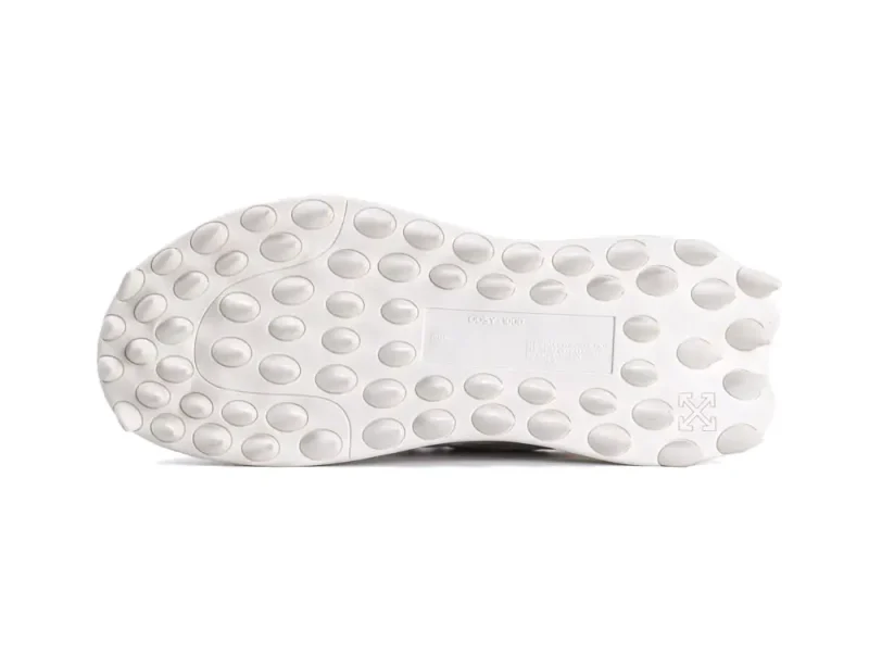White rubber shoe sole with circular traction pattern, designed for grip and durability.