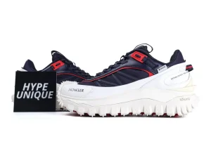 White cardboard shoebox with red and black details, featuring a sneaker image.