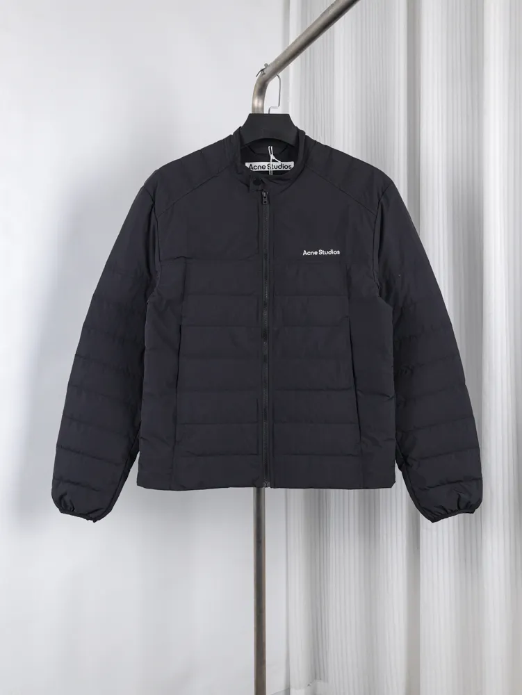 Black jacket featuring a front zipper closure.