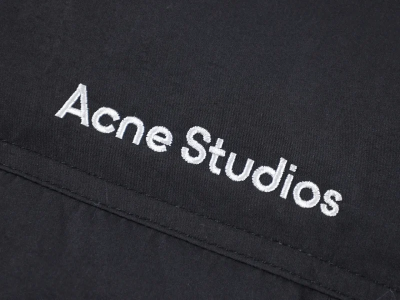 Embroidered text, showcasing Acne Studios