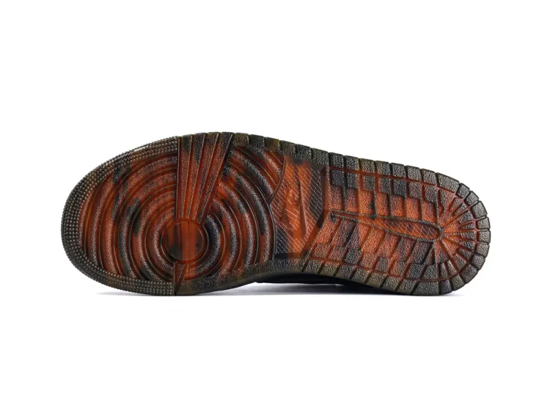 Brown and black rubber shoe sole with textured grip patterns.