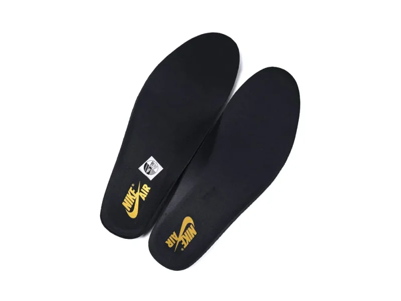 Black foam shoe insoles with yellow logo and textured design.