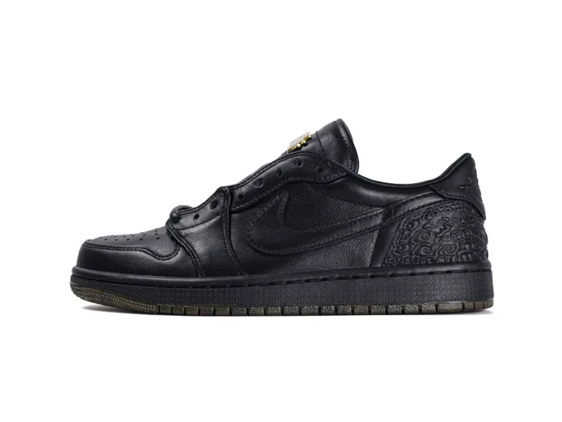 Black leather sneaker with engraved heel design and rubber sole.