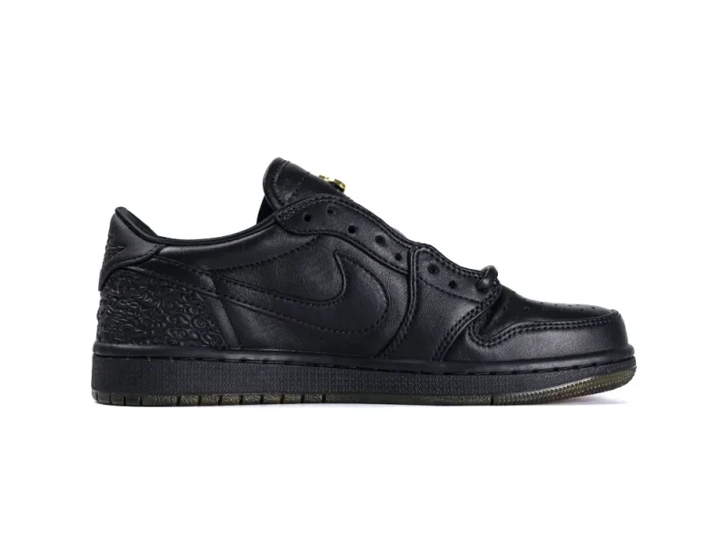 Black leather sneaker with textured heel and smooth upper design.