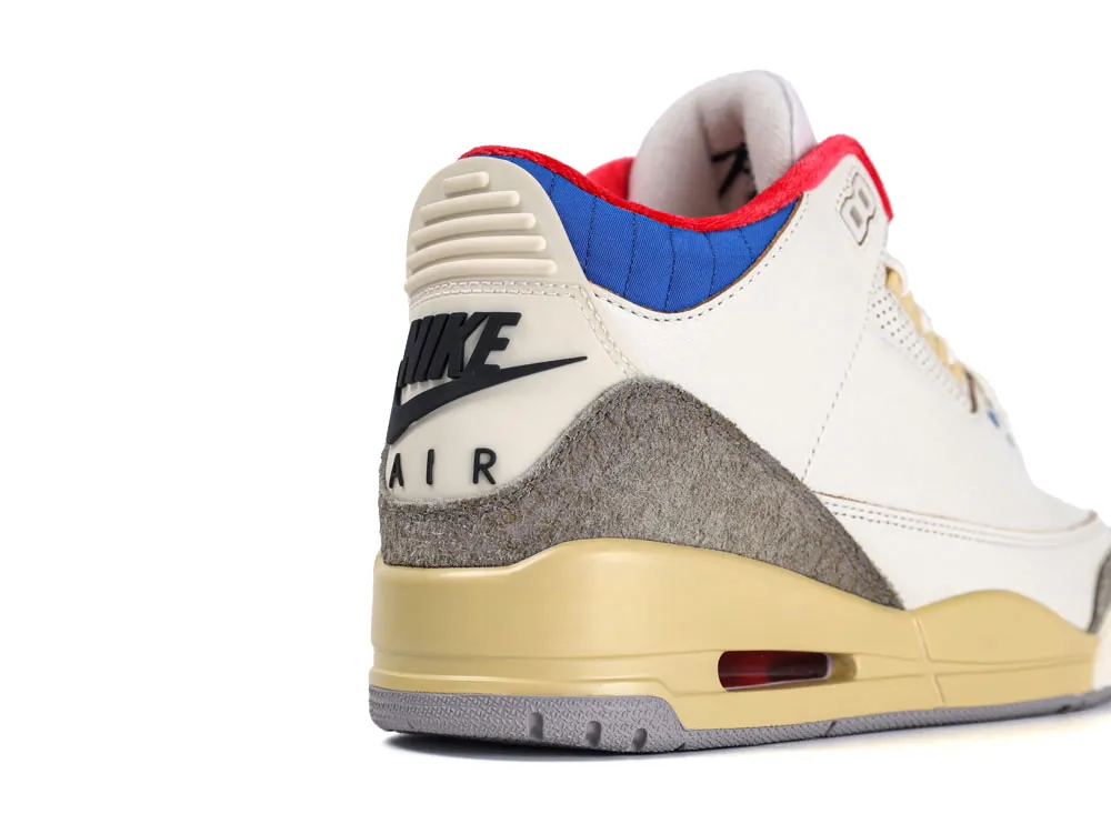 Cream leather sneaker with gray suede, blue accents, and beige midsole detail.