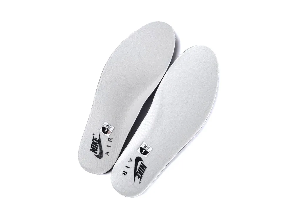 White foam insoles featuring branding, designed for comfort and support in shoes.