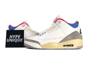 White leather sneakers with gray suede accents, yellow midsole, and blue inner lining.
