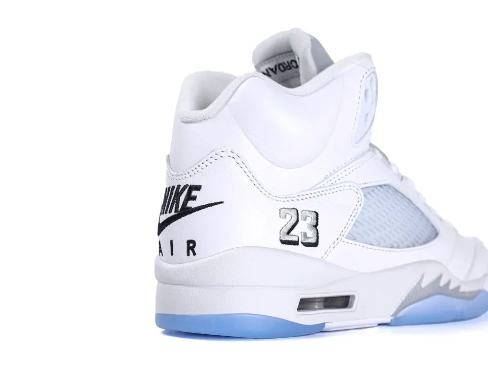 White and gray leather sneaker with blue sole and breathable mesh panel.