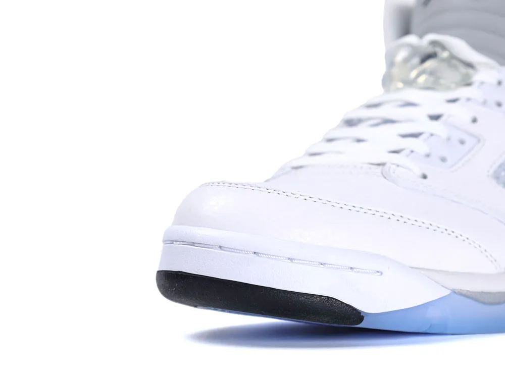 White leather sneaker with black rubber sole and gray padded ankle, close-up view.