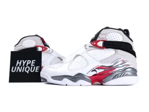 White leather and red synthetic sneakers with black accents and graphic design.