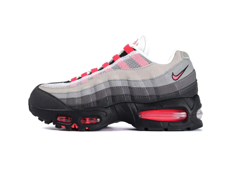 Gray, white, and pink sneaker with mesh upper, suede accents, and black sole.