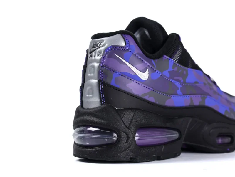 Purple and black sneaker with a camouflage pattern and visible air cushion sole.