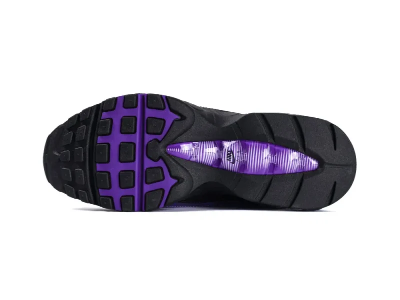 Black rubber sole with purple accents, featuring textured treads for grip.