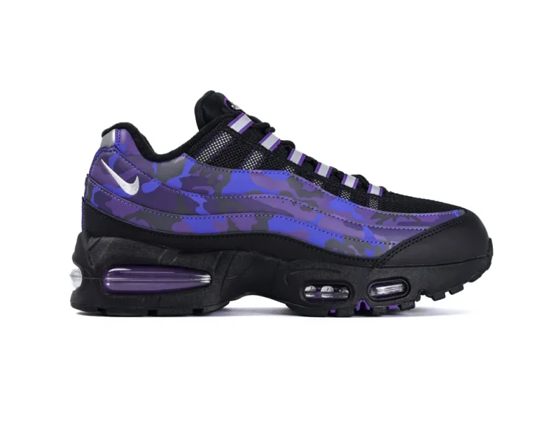 Black and purple sneaker with mesh upper and transparent air cushioning in sole.
