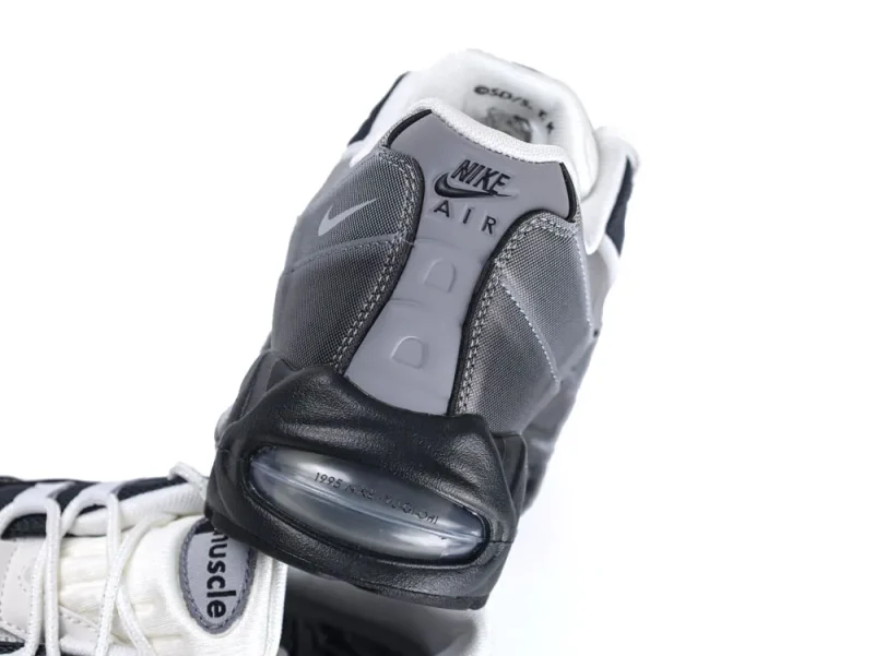 Gray and black sneaker with mesh material and visible air sole unit.
