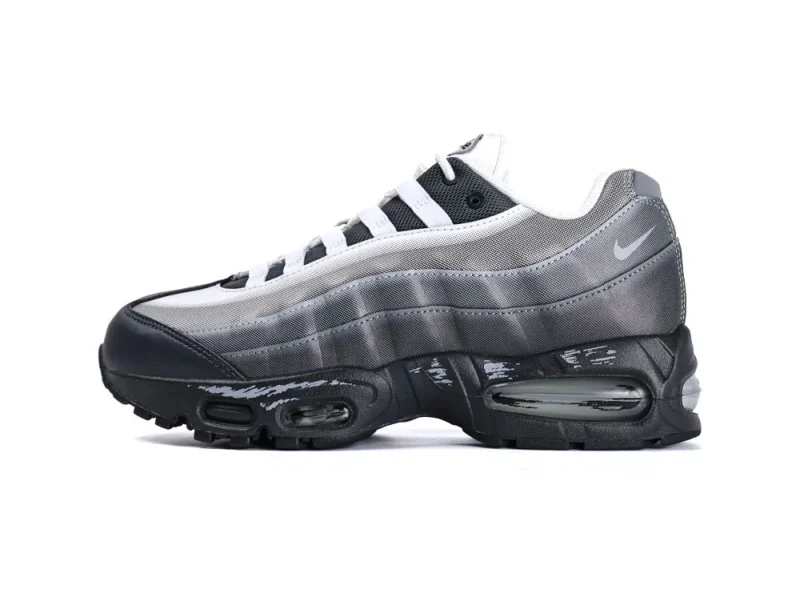 Gray and black sneaker with mesh upper, featuring visible air cushioning and rubber sole.