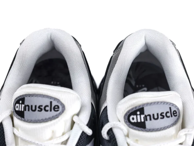 Gray and white fabric sneakers with padded collars and branded tongue labels.