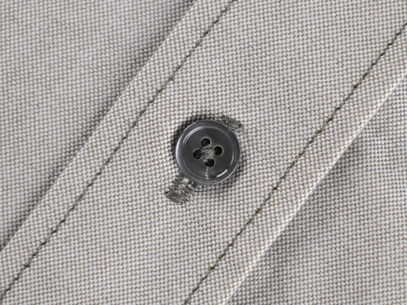 Close-up of black button detail.