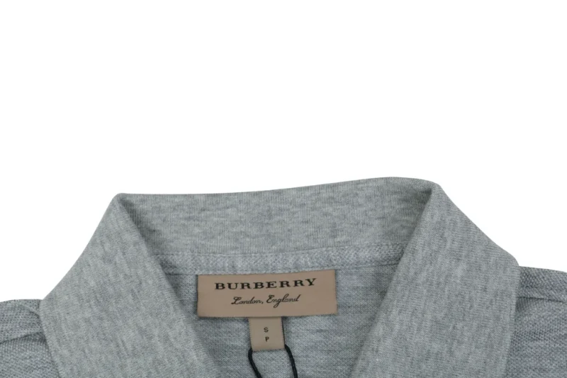 Gray fabric collar with label, made from soft, textured material.