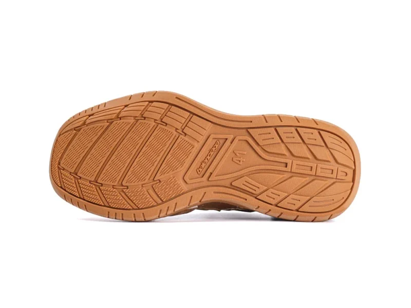 Brown rubber shoe sole with a textured pattern for grip and durability.