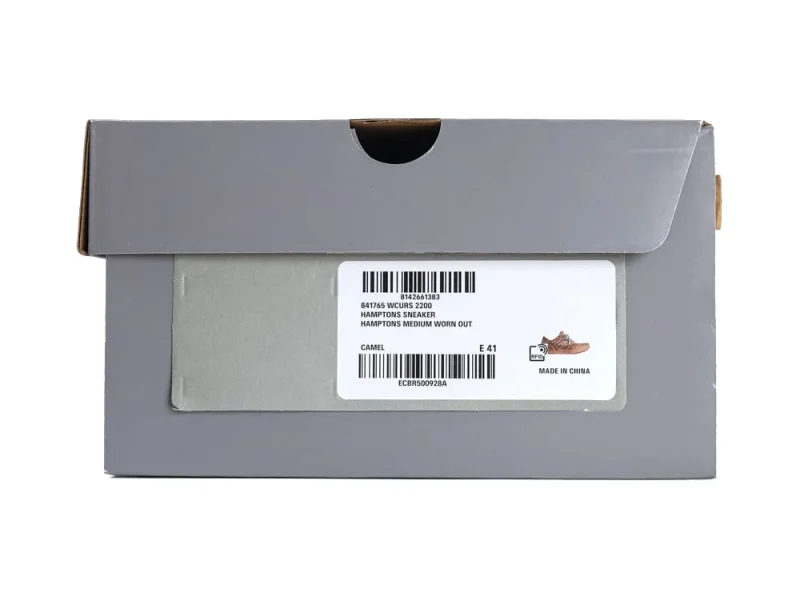 Gray shoebox with product label, featuring camel-colored sneakers, cardboard material.