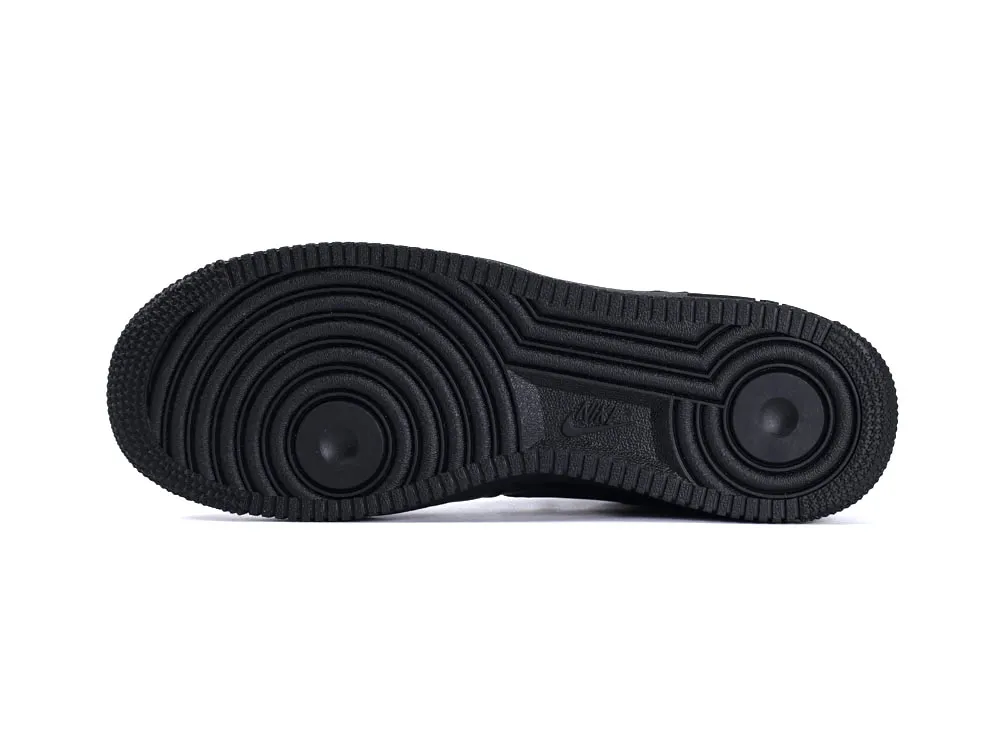 Black rubber outsole with circular tread pattern, designed for grip and durability.