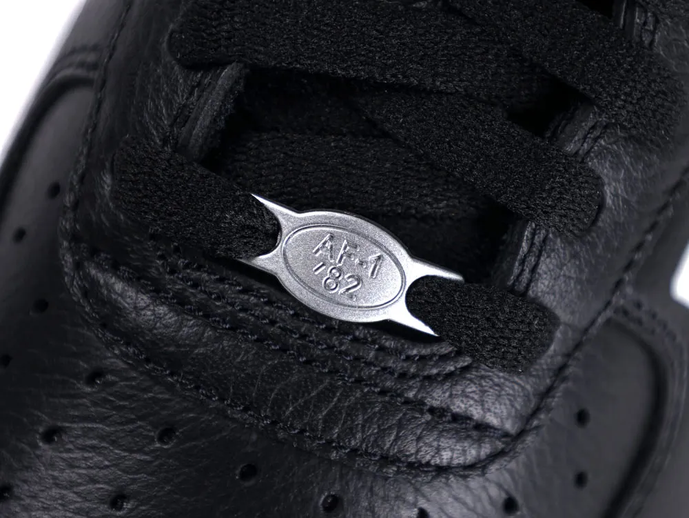 Black leather sneaker with black laces and silver "AF1 '82" emblem detail.