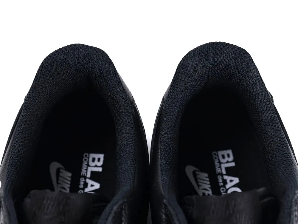 Black fabric lining inside sneakers with visible branding on the insole.