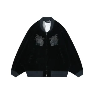 Black velvet jacket with gray ribbed cuffs, featuring embroidered designs on the chest.