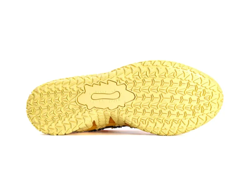 Yellow rubber shoe sole featuring an anti-slip pattern for enhanced traction.