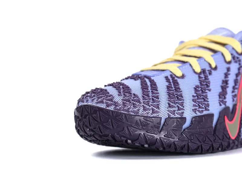 Purple and blue textile sneaker with textured sole and yellow laces.