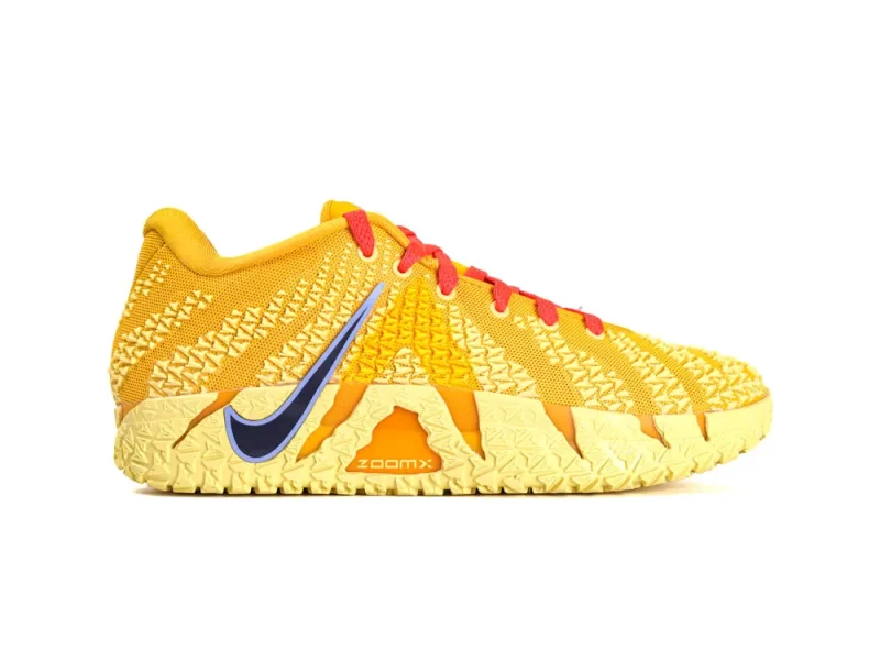 Yellow mesh sneakers with red laces, textured sole, and blue logo accent.