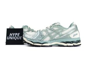 Mint green mesh sneakers with white accents and a sturdy rubber sole.