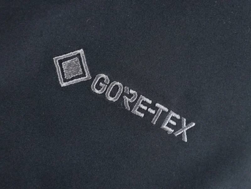 Black GORE-TEX fabric with embroidered logo