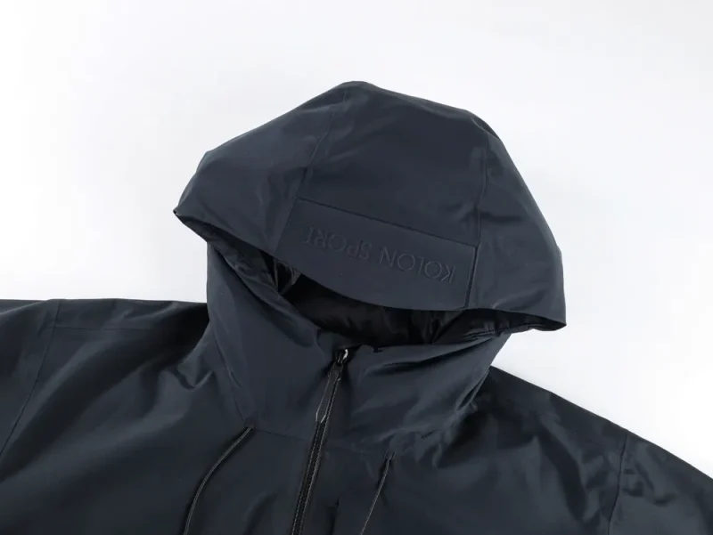 Hooded jacket made of synthetic material with visible zipper and drawstring.